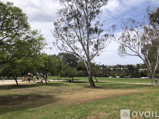 A park with trees and a playground.