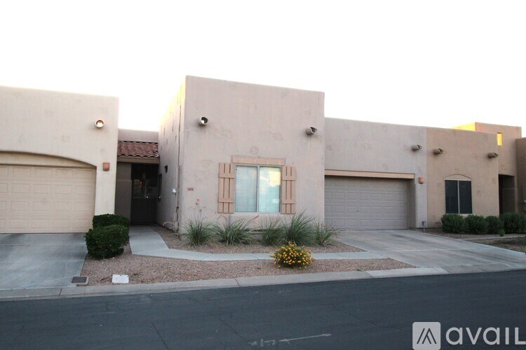A modern house with a garage door and a window.