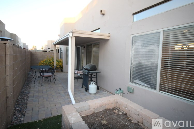 A patio with a table and chairs is visible.
