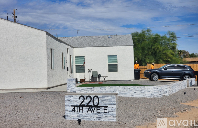 A house with a sign that says 220 4th Ave.