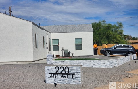 A house with a sign that says 220 4th Ave.