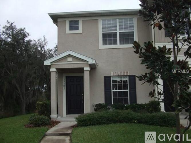 A house with a black front door and a small porch.