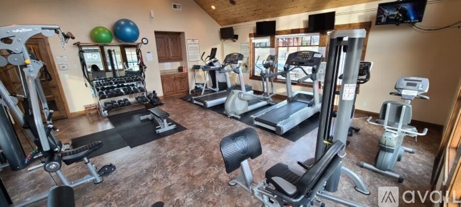 A well-equipped gym with a variety of exercise machines.