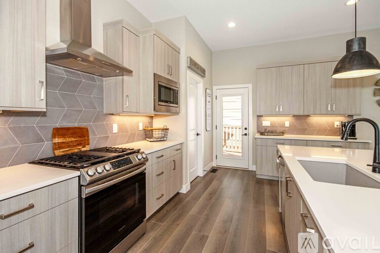 A kitchen with a stove top oven and a microwave.