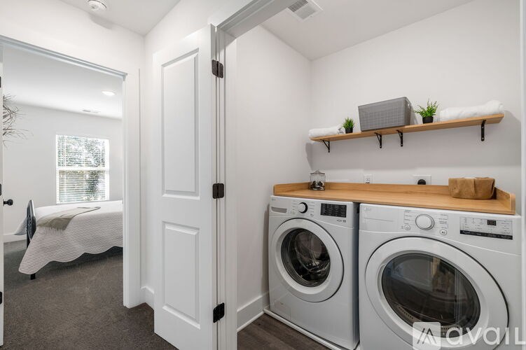 A laundry room with a washer and dryer.