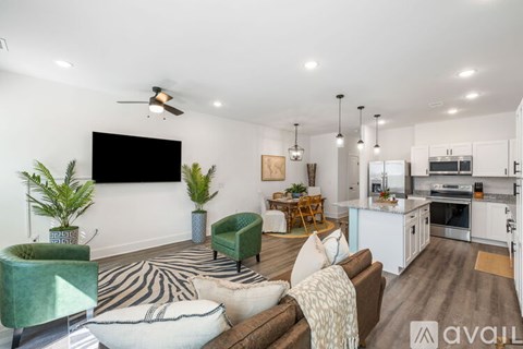 A living room with a zebra rug and a couch.