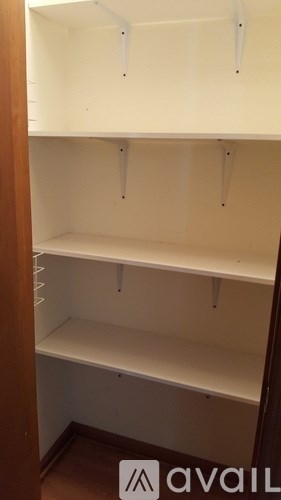 A white shelf with a sign that says "available" on the bottom.