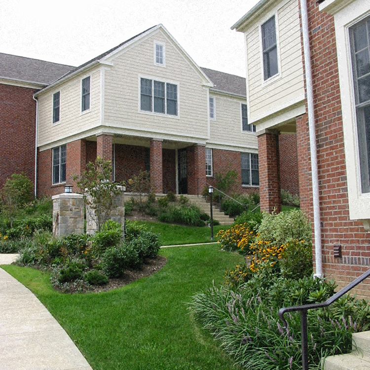 the front yard of a house with a garden