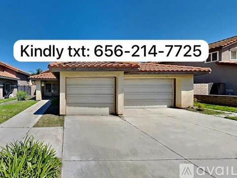 A garage with a number and a text overlay that says "Kindly txt: 656-214-7725".