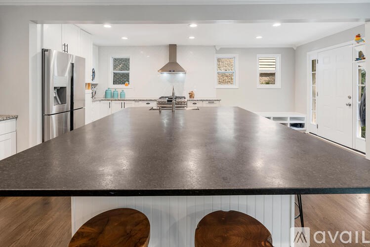 A modern kitchen with a large island in the center.