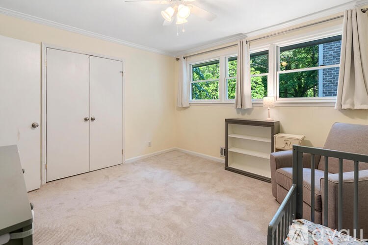 A baby room with a crib and a changing table.