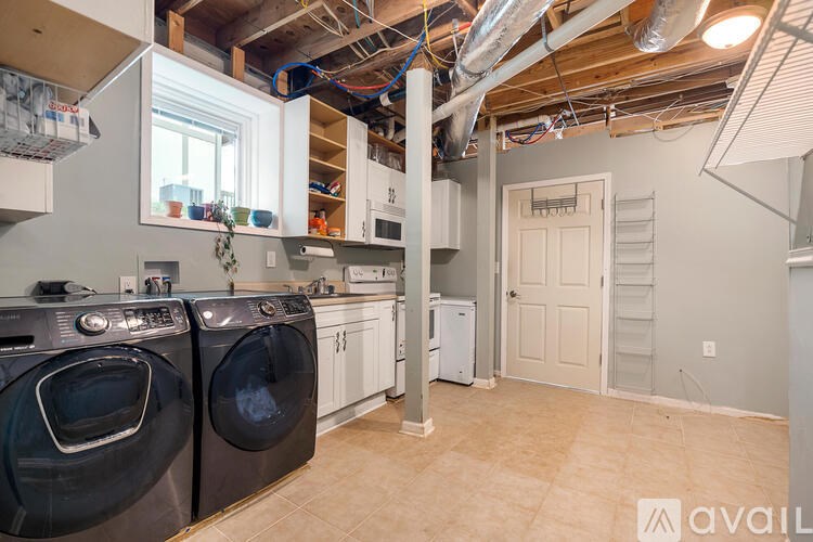 A laundry room with a washer and dryer.