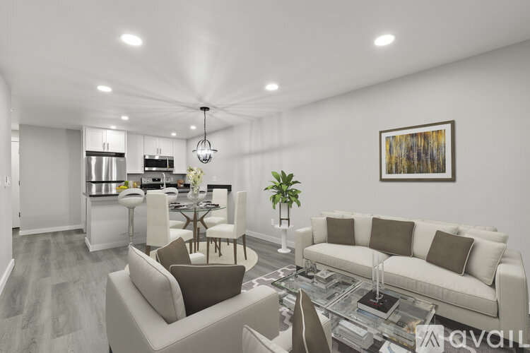A modern living room with a white couch and a coffee table.