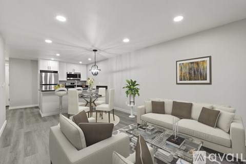 A modern living room with a white couch and a coffee table.