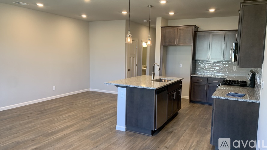 A kitchen with a large island in the middle of the room.