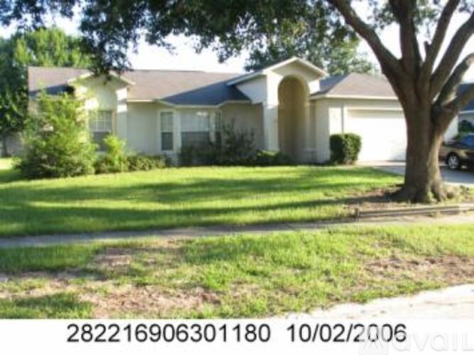 A house with a tree in front of it.
