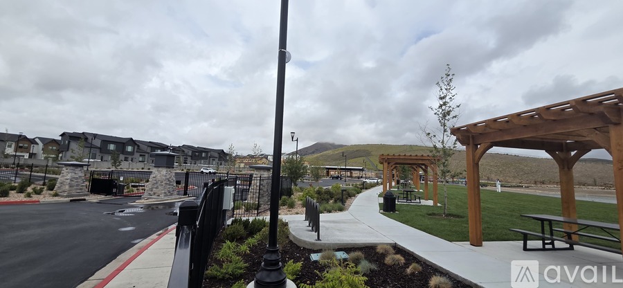 A park with a bench and a gazebo is available for use.