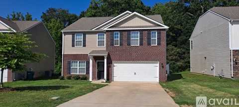 A house with a garage is for sale.