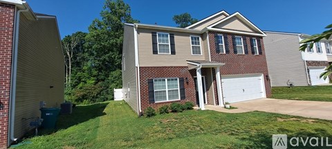 A house with a garage is for sale.