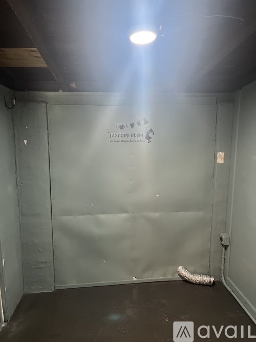 A room with a wall that has a sticker on it.