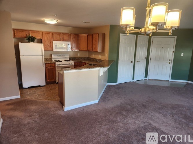 A bathroom with a toilet, sink, and bathtub.