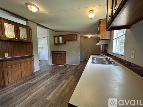 A kitchen with wooden cabinets and a countertop.