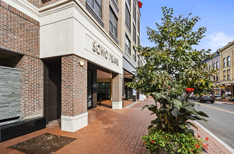 A brick building with a sign that says "Sonoma Plaza" on it.