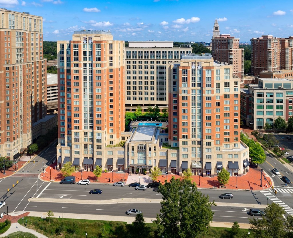 A city street with cars and buildings.