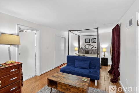 A dining room with a table set for six.