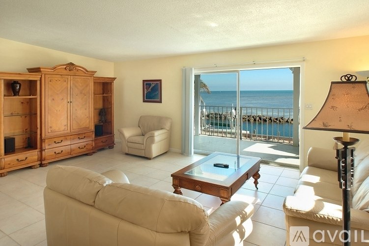 A living room with a view of the beach.