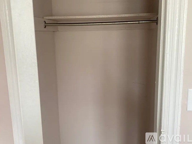 A white door with a metal handle and a white frame.