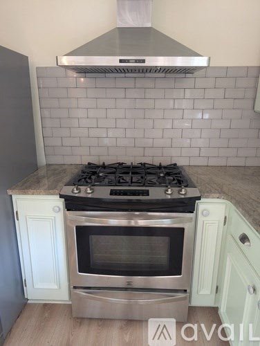 A kitchen with a stove top oven and a microwave.
