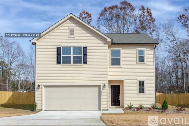 A two-story house with a garage is for sale at 179 Lynn Dr.