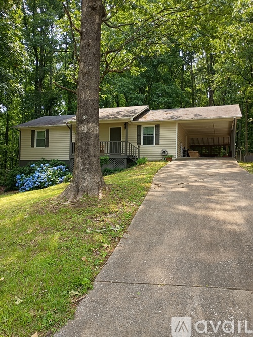 A house with a driveway in front of it.