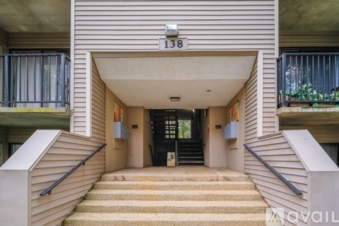 The entrance to a building with the number 138 on the wall.