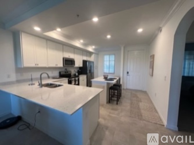 A kitchen with a countertop and a sink.