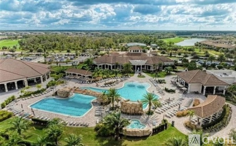 A large, luxurious house with a swimming pool and a hot tub.