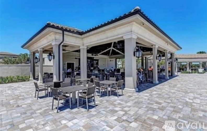 A patio with tables and chairs is available for use.