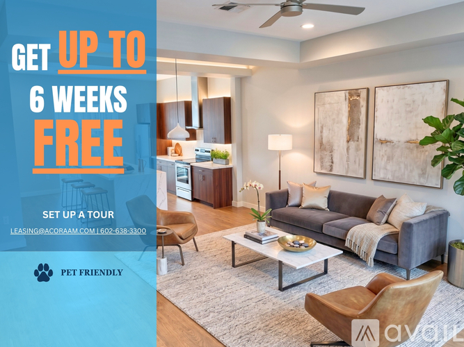 A modern two-story building with a sign offering a free first month for a move-in special.