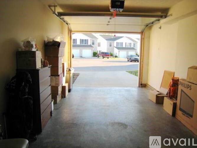 A garage with boxes and a Philips sign on the wall.