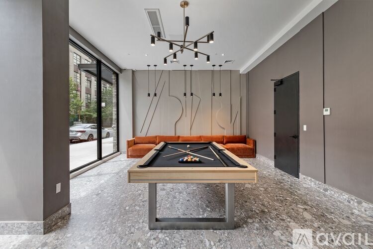 A pool table in a room with a modern design.