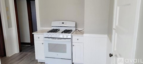 A white stove and oven in a kitchen.