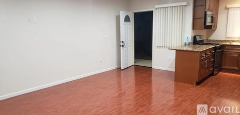 A kitchen area with a counter and cabinets.