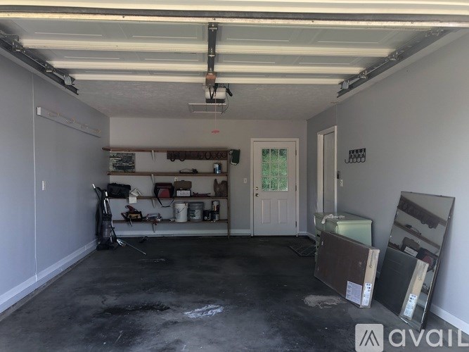 A large empty garage with a lot of tools and equipment.