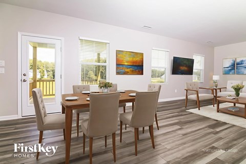 A dining room with a table set for six.