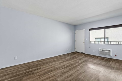 A room with a window and a door.