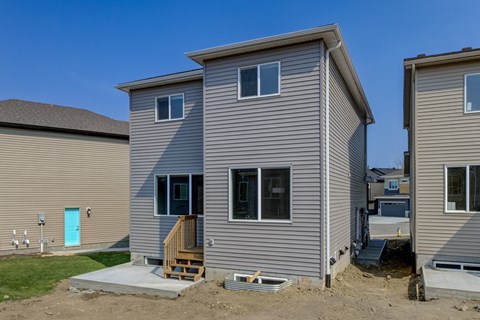 A house with a blue door and a porch.