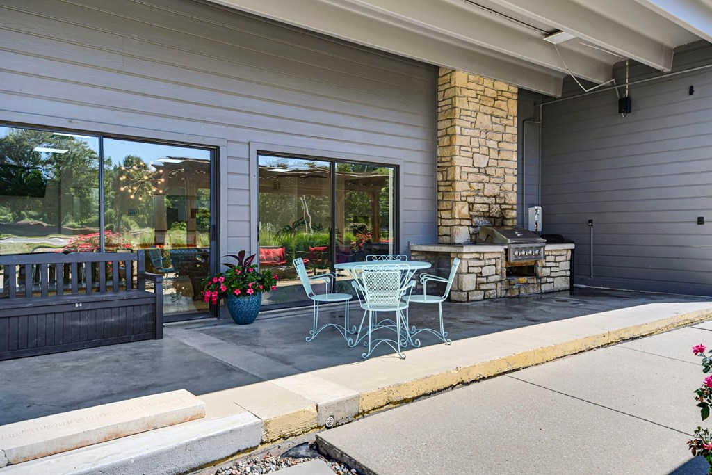 A patio with a table and chairs is shown.