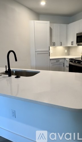 A room with wooden flooring and a sliding glass door.