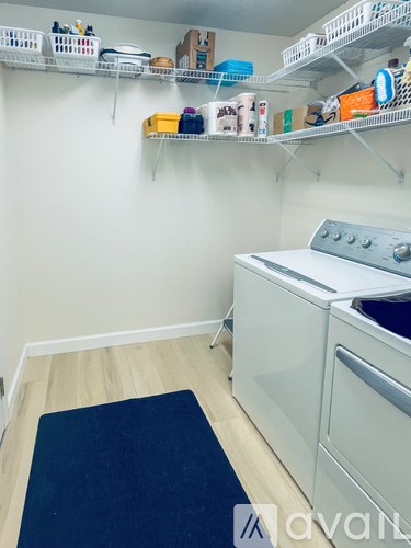 A laundry room with a washer and dryer.